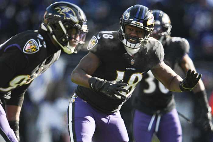 Dec 24, 2022; Baltimore, Maryland, USA; Baltimore Ravens linebacker Roquan Smith (18) directs linebacker Odafe Oweh (99) during the first half against the Atlanta Falcons at M&T Bank Stadium. Mandatory Credit: Tommy Gilligan-USA TODAY Sports